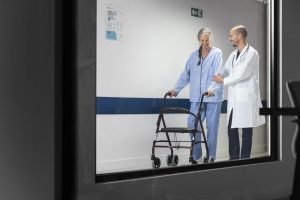 doctor_helping_patient_walk-37184159