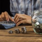 man_calculating_monthly_savings-37089491