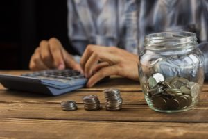 man_calculating_monthly_savings-37089491
