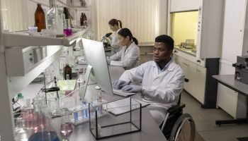 Disabled scientist working on computer